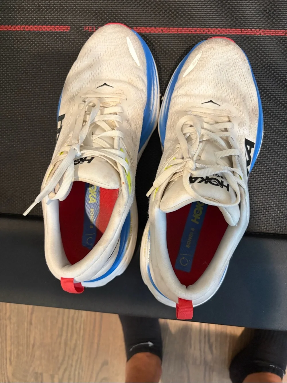 Hoka White Trainers with Blue Midsole and Red Outsole